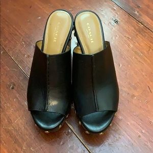 Coach black wedge slip ons